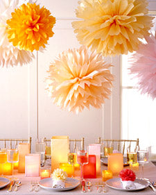 orange tissue pom poms