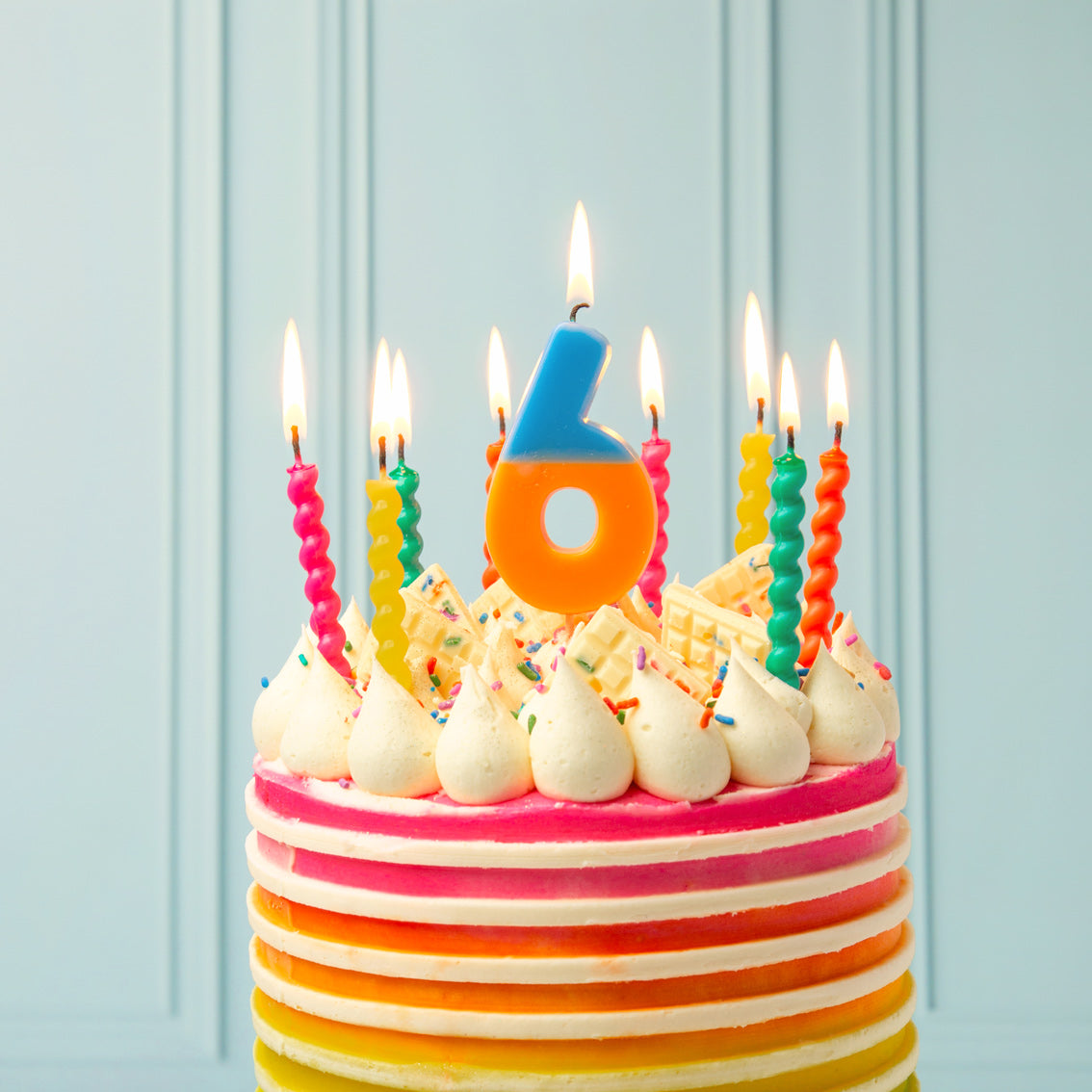 bright birthday cake with candles