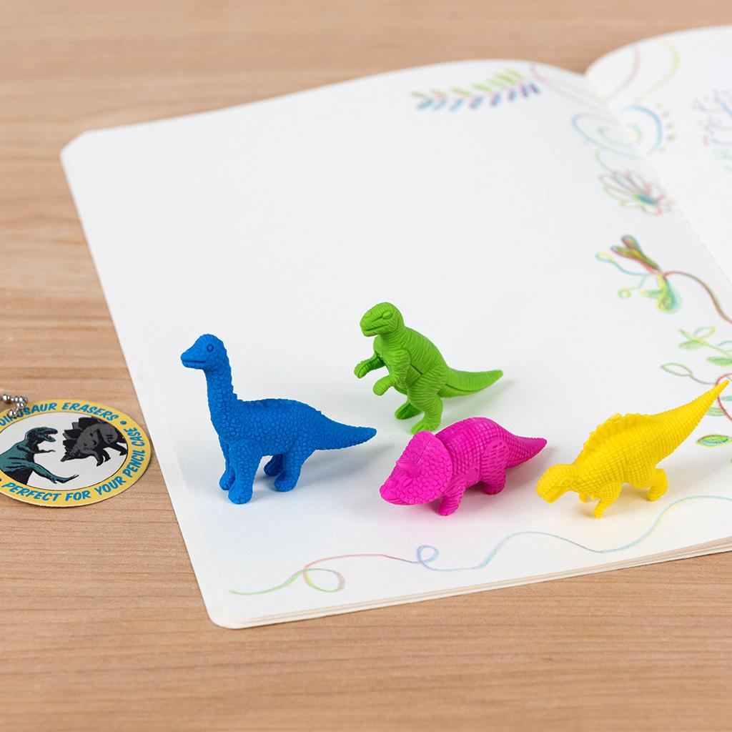 dinosaur eraser on book
